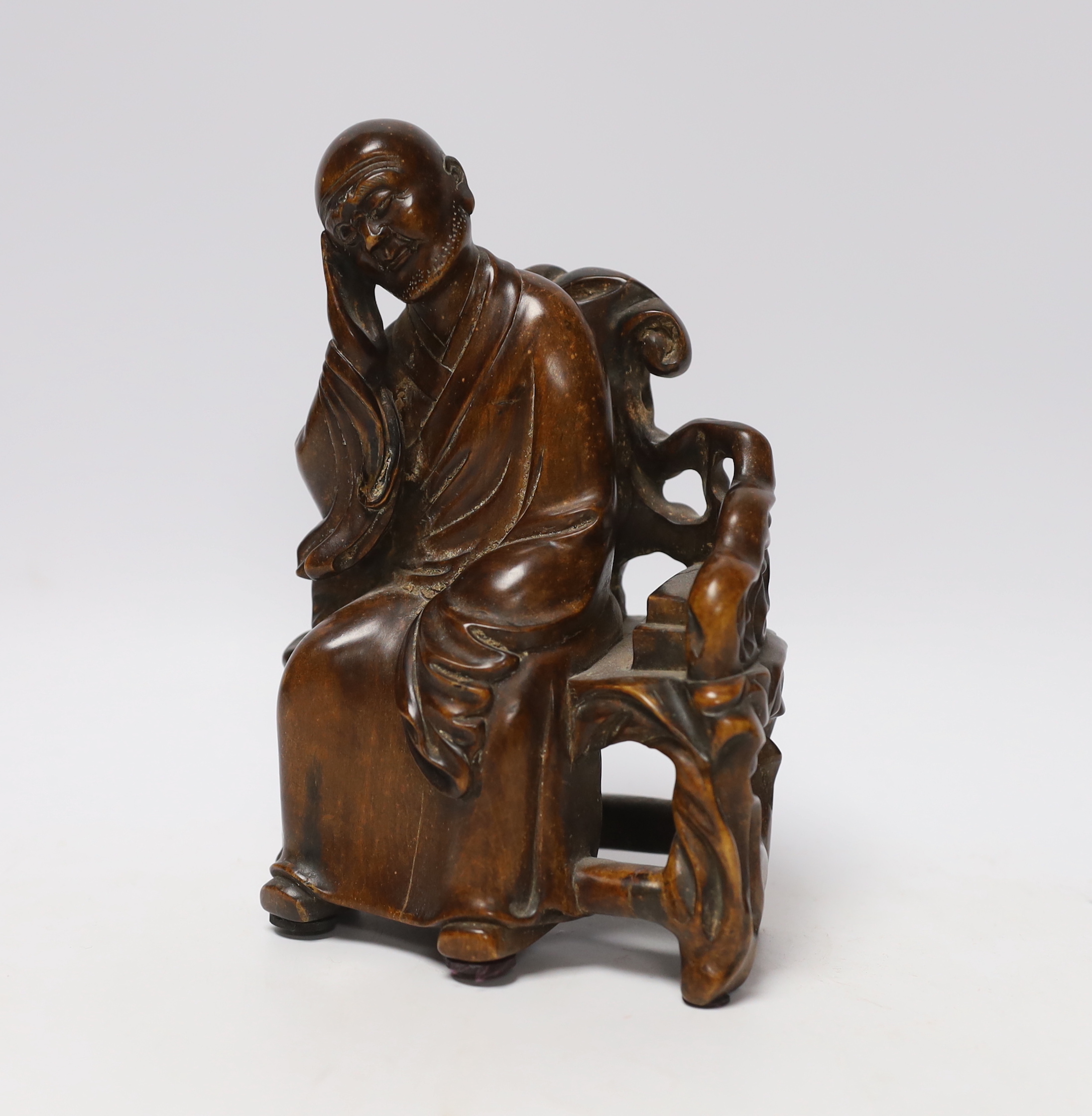 A Chinese carved wood figure of a scholar, 19cm